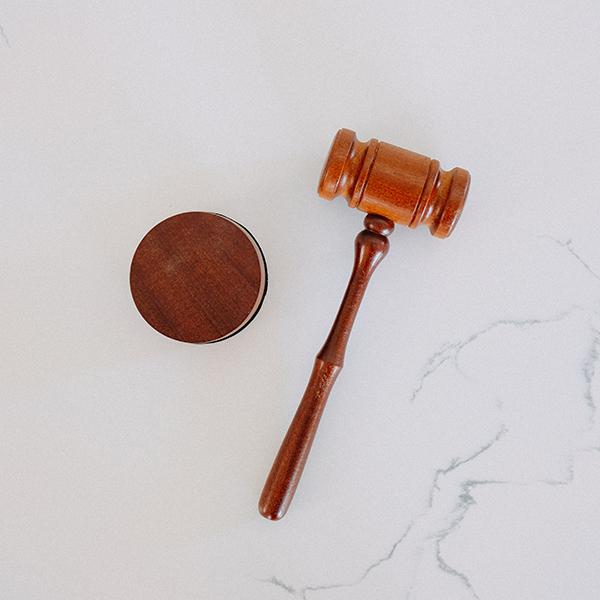 Wooden gavel on a marble table