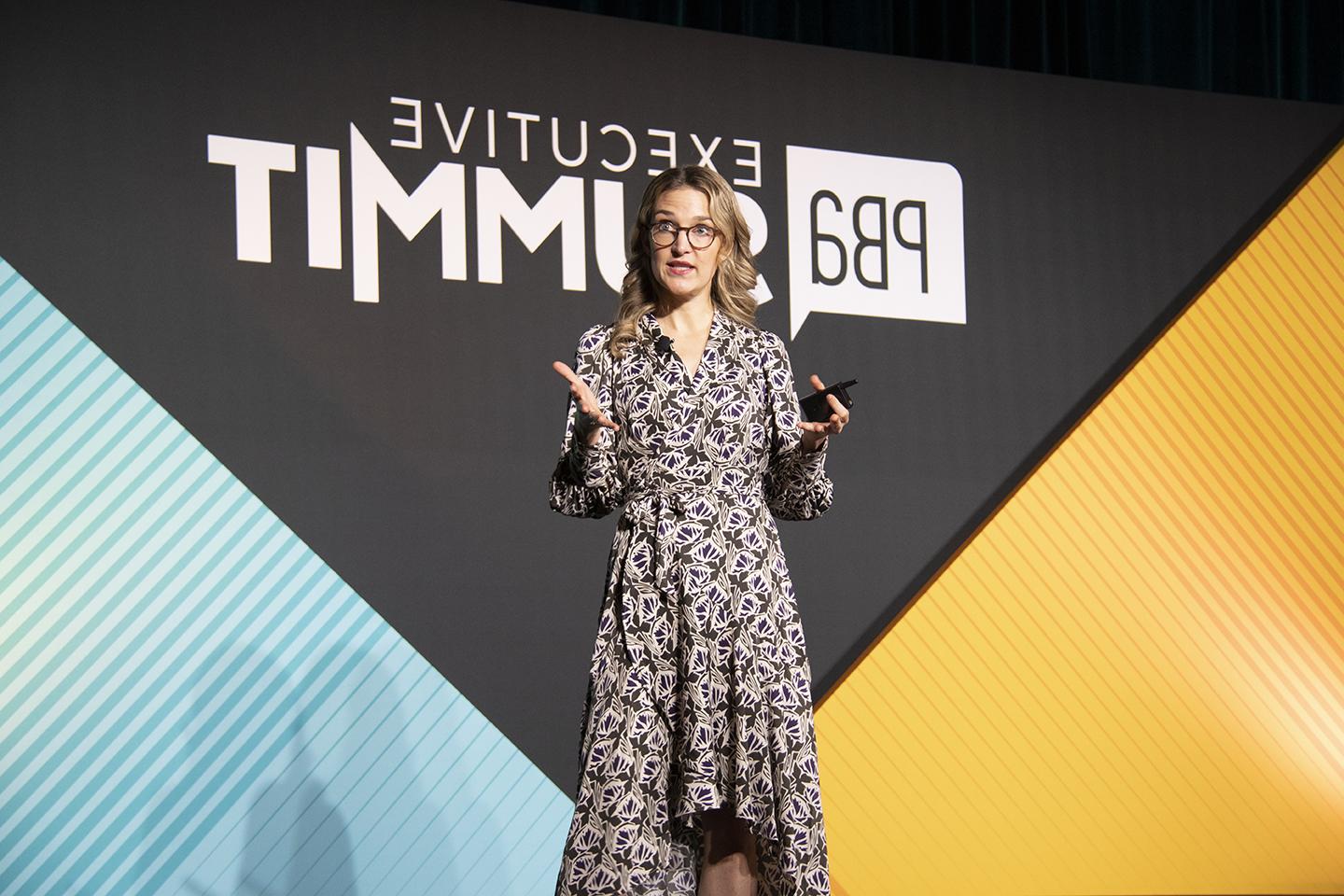 Image of a woman speaking at the executive summit
