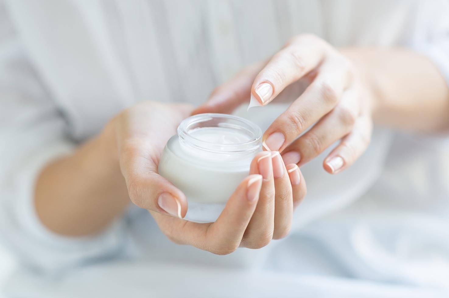 Image of a person holding creme